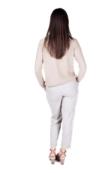 Bakifrån stående ung vacker brunett kvinna. — Stockfoto