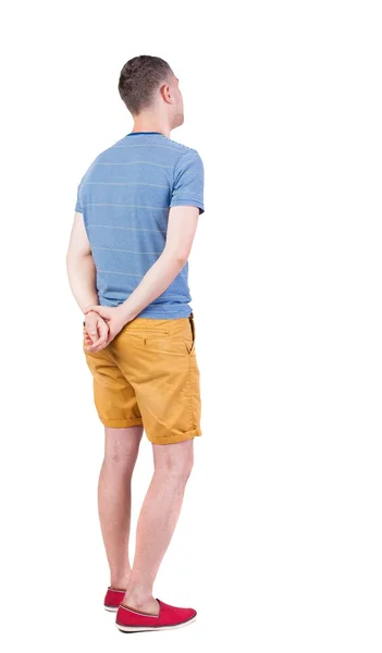 Back view of young manin shorts looking. — Stock Photo, Image