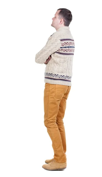 Achteraanzicht van knappe man in warme trui opzoeken. — Stockfoto
