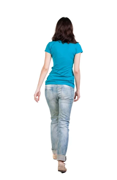 Back view of walking  woman in jeans . — Stockfoto