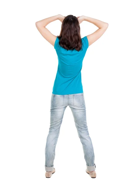 Вид сзади потрясен женщины в синие джинсы — стоковое фото