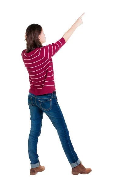 Bakifrån av pekar kvinna. — Stockfoto