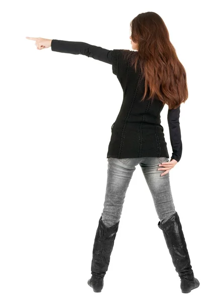 Bakifrån av pekar kvinna. — Stockfoto