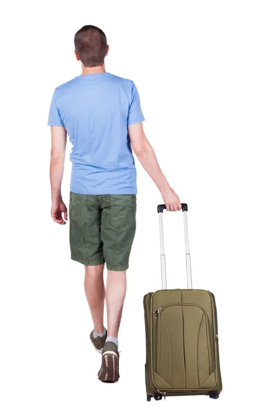 Back view of walking  man  with suitcase. — Stock Photo, Image