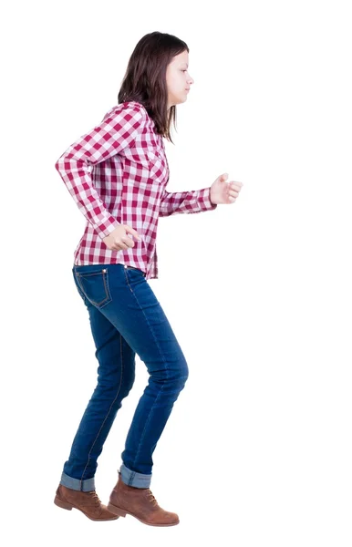 Back view of running  woman in checkered shirt — Stock Photo, Image