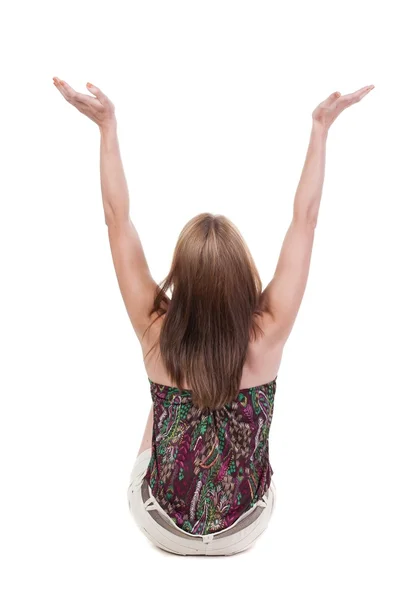 Back view of Beautiful woman in jeans looking at wall and Holds — Stock Photo, Image