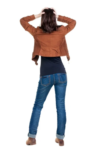 Bakifrån av chockad kvinna i blå jeans. — Stockfoto