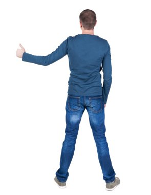 Arkadan Görünüm adamın t-shirt. başparmak kadar gösterir.