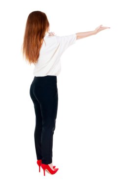 arkadan görünüşü güzel bir iş kadını duvar ve tutan eller yukarıda bakarak Suite.