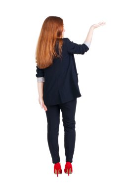 arkadan görünüşü güzel bir iş kadını duvar ve tutan eller yukarıda bakarak Suite.