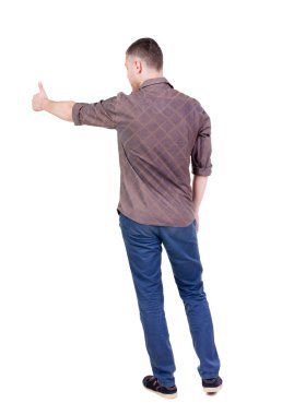 başparmak Kareli gömlekli adam arkadan görünüm gösterir.