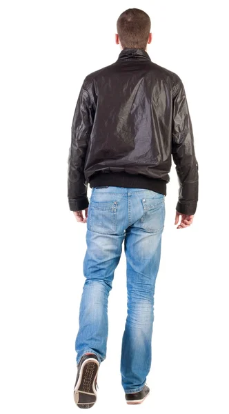 Pohled zezadu na chůzi pohledný muž v saku. — Stock fotografie