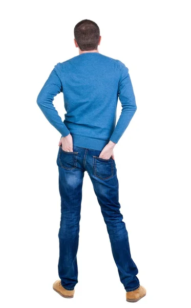 Back view of handsome man in blue pullover looking up. — Stock Photo, Image