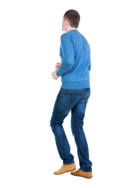 Achteraanzicht van het runnen van man in blauwe pullover. — Stockfoto