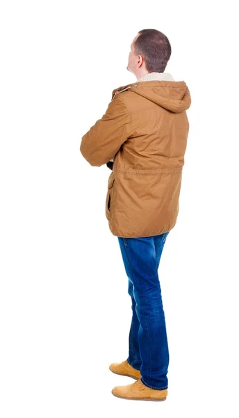 Pohled pohledný muž v zimní bundu při pohledu zezadu — Stock fotografie