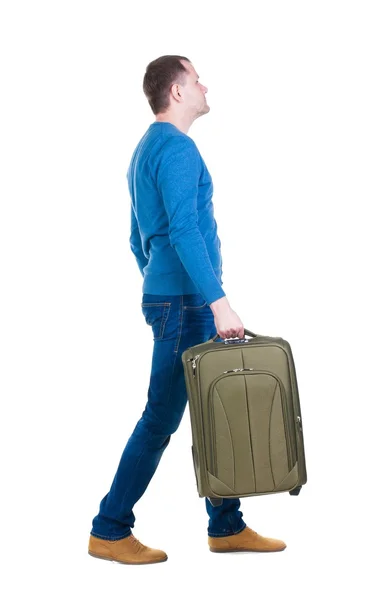 Vista para trás do homem de passeio com mala de viagem. — Fotografia de Stock