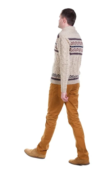 Back view of going  handsome man in jeans and warm sweater. — Stock Photo, Image