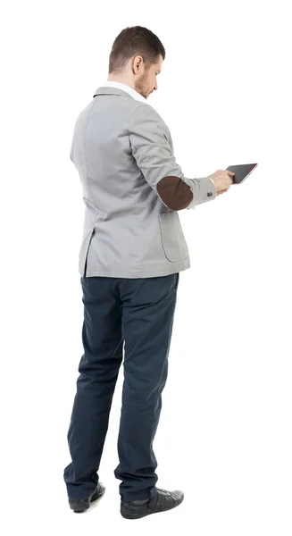 Back view of business man uses mobile phone. — Stock Photo, Image