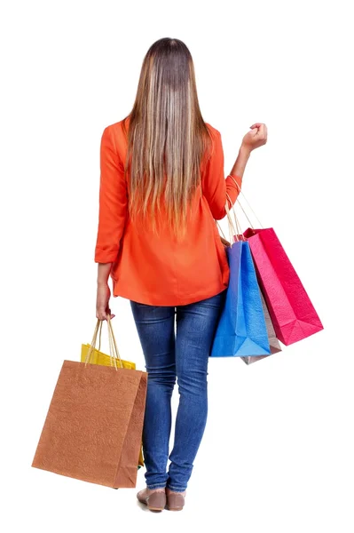 Vista trasera de la mujer con bolsas de compras — Foto de Stock