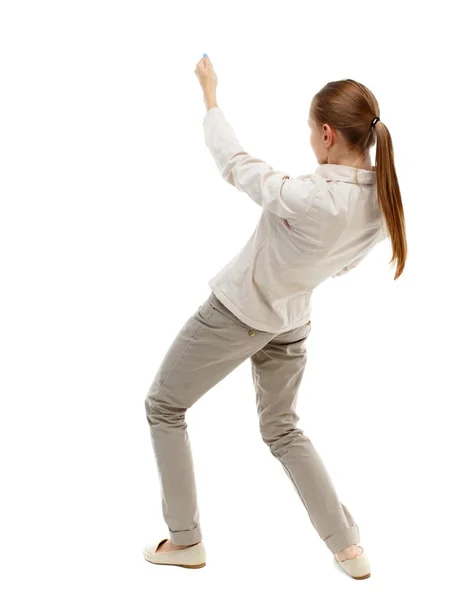 Back view of standing girl pulling a rope from top or cling to s — Stock Photo, Image