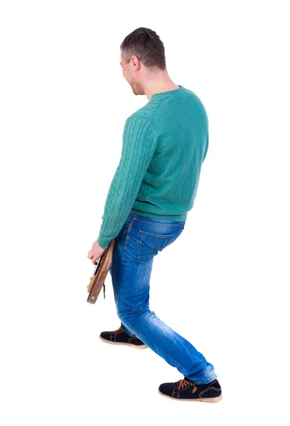 Vue arrière du jeune homme avec une guitare. — Photo