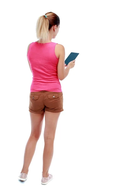 Back view of standing young beautiful  woman using a mobile phon — Stock Photo, Image