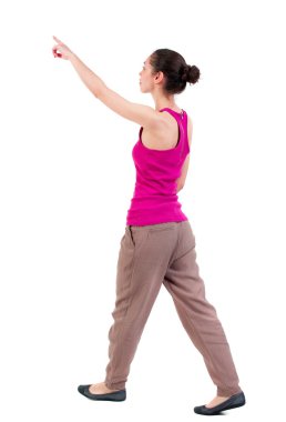 back view of pointing walking  woman