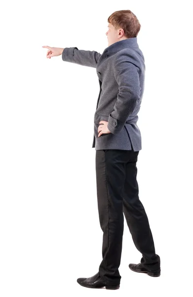 Back view of  pointing young business men in  coat — Stock Photo, Image