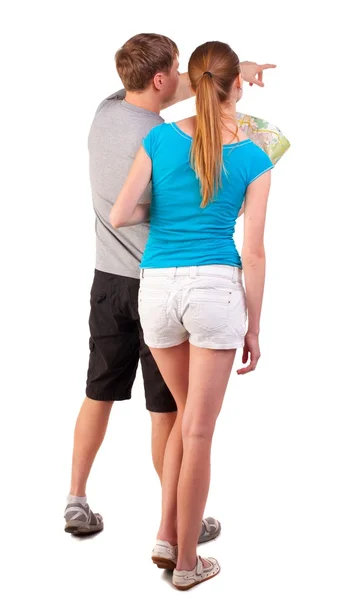 Back view journey of the young couple looking at the map — Stock Photo, Image