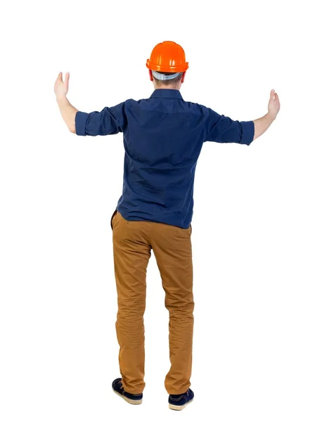 Back view of builder in helmet shows thumbs up — Stock Photo, Image