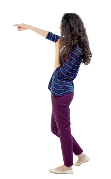 Back view of  pointing woman. beautiful girl. — Stock Photo, Image