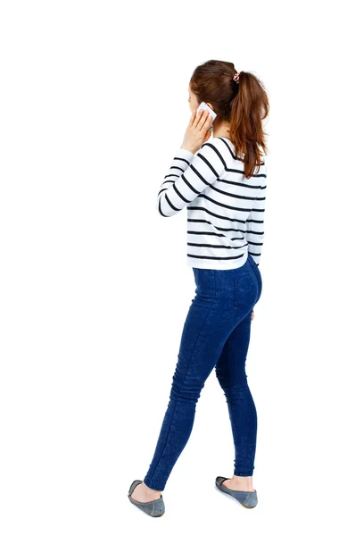 Back view of a woman talking on the phone. — Stock Photo, Image