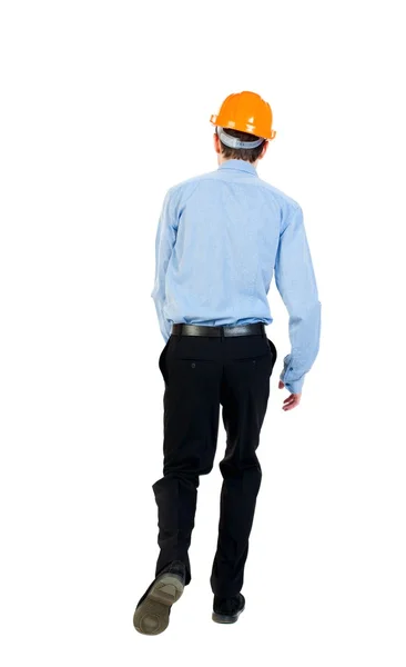 Back view of running engineer in helmet. — Stock Photo, Image