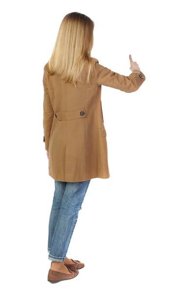 Back view of  pointing young women in parka. — Stock Photo, Image