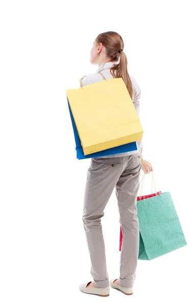 Vista trasera de la mujer con bolsas de compras — Foto de Stock