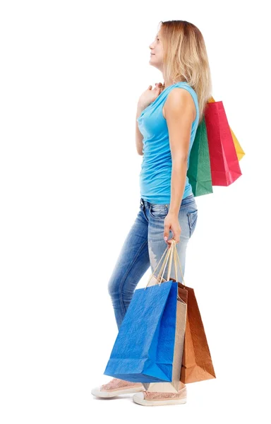 Side view of going  woman  with shopping bags . — Fotografia de Stock