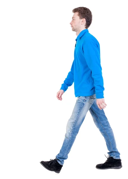 Rückansicht des gehen gut aussehender Mann. jungen Mann Fuß — Stockfoto