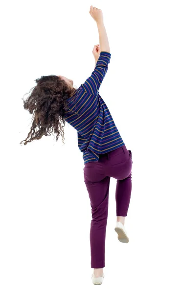 Back view of dancing young beautiful  woman. girl  watching. — Stock Photo, Image