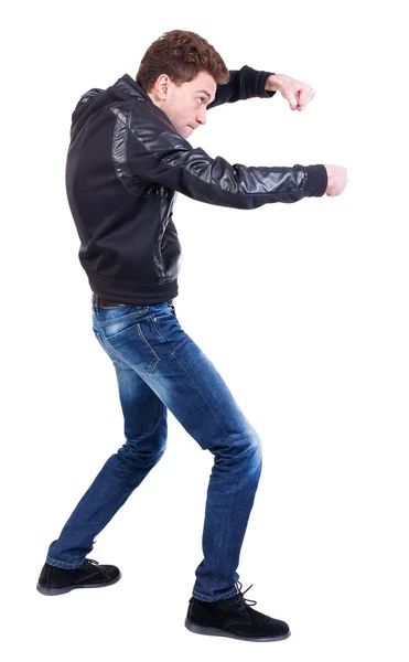 Back view of guy funny fights waving his arms and legs. — Stock Photo, Image