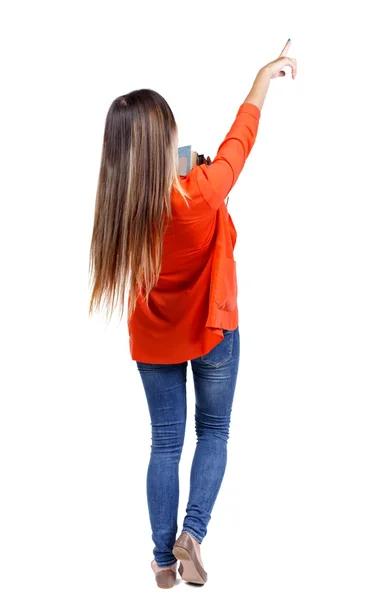 Back view pointing woman with a stack of books. — 图库照片