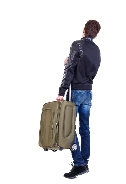 Hátulnézet ember keresi fel zöld bőrönddel. — Stock Fotó