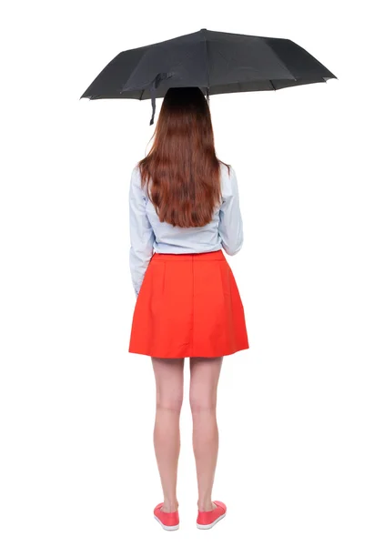 Junge Frau unter einem Regenschirm. — Stockfoto