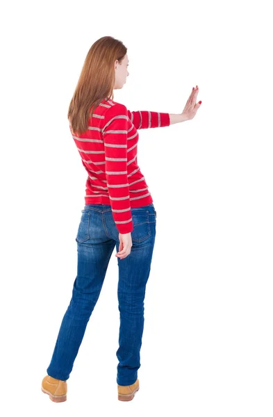 Back view of woman. Young woman presses down on something. — Stock Photo, Image