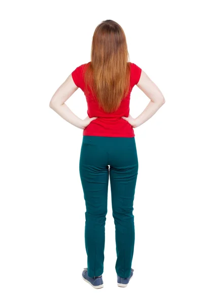 Rückansicht der stehenden jungen schönen Frau in Jeans. — Stockfoto