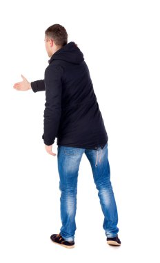 man in jacket holds out his hand for handshake.