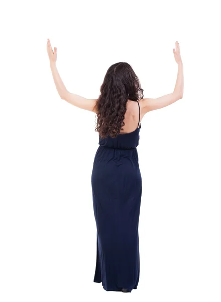 Rückansicht des schöne Frau im Kleid, Blick auf Mauer und hält — Stockfoto