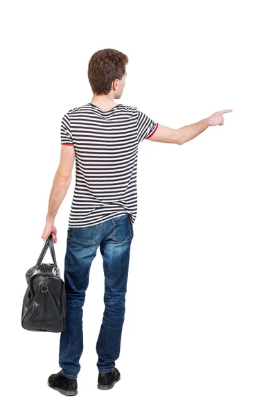 Back view of  pointing man  with bag. — Stock Photo, Image