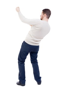 Arkadan ayakta adam bir ip üstten çekerek görünüşü veya t sarılmak