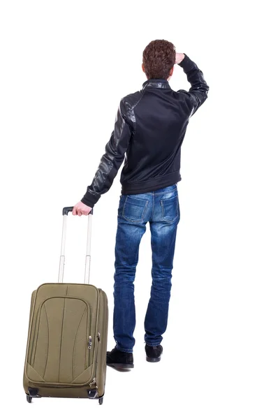 Back view of man with  green suitcase looking up. — Stock Photo, Image