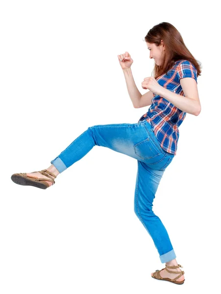 Back view of woman funny fights waving his arms and legs. — Stock Photo, Image